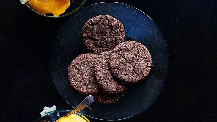 chocolate-olive oil crisps served on a blue plate