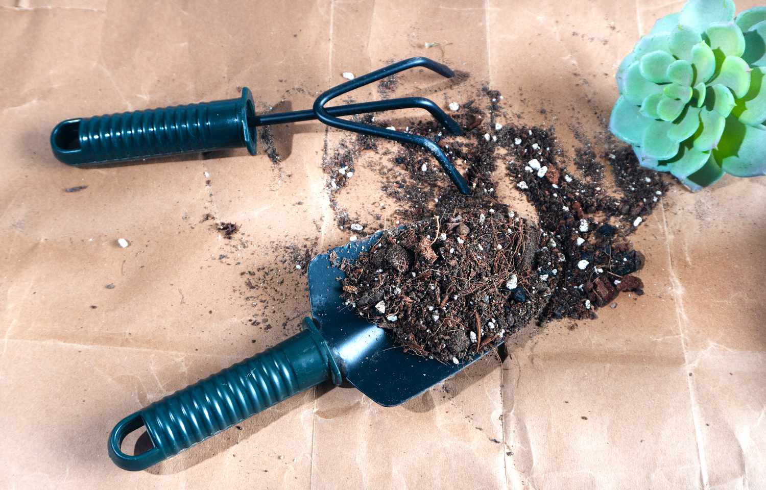 soil with perlite with garden tools