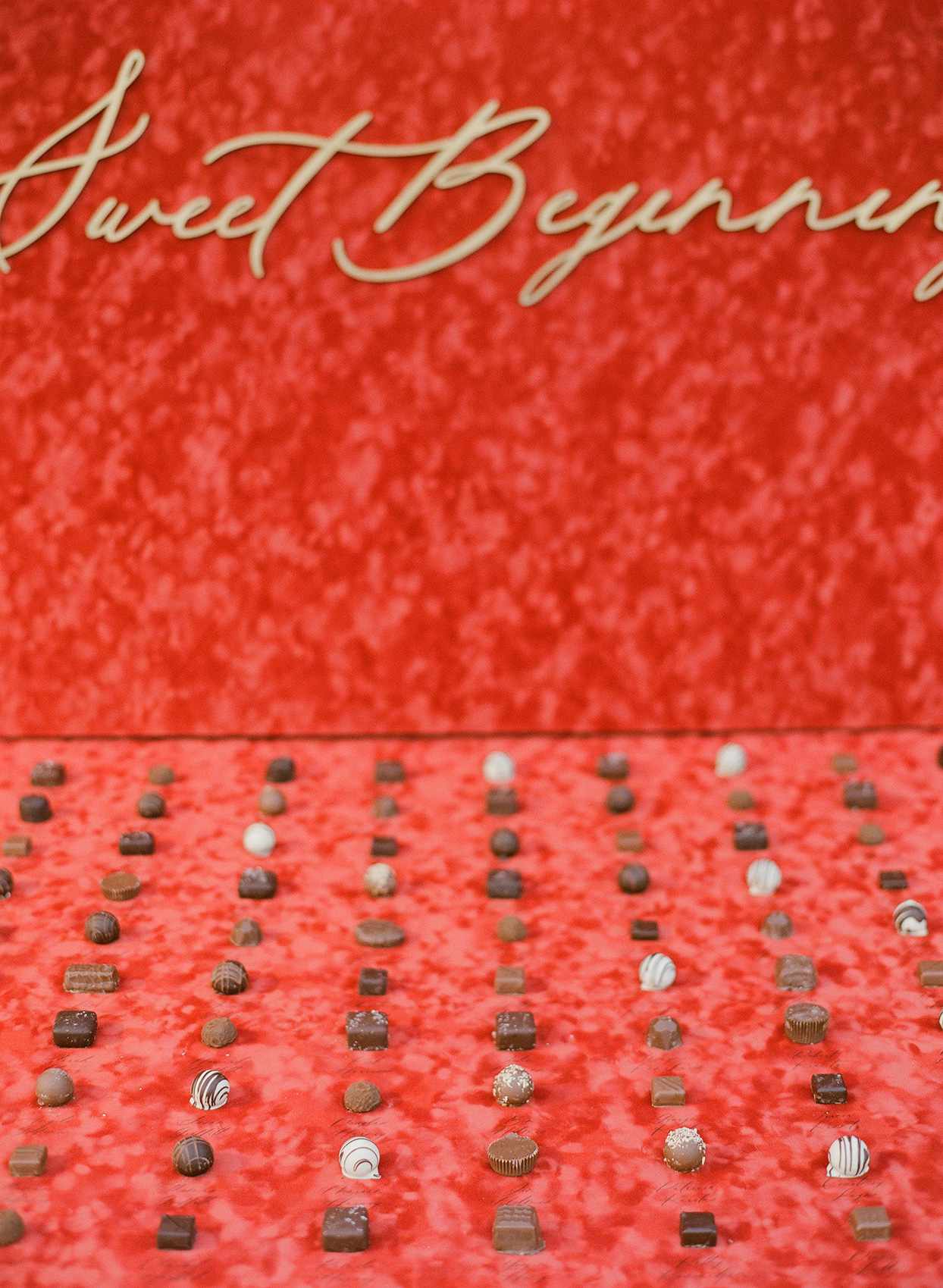 red backdrop chocolate truffle dessert station