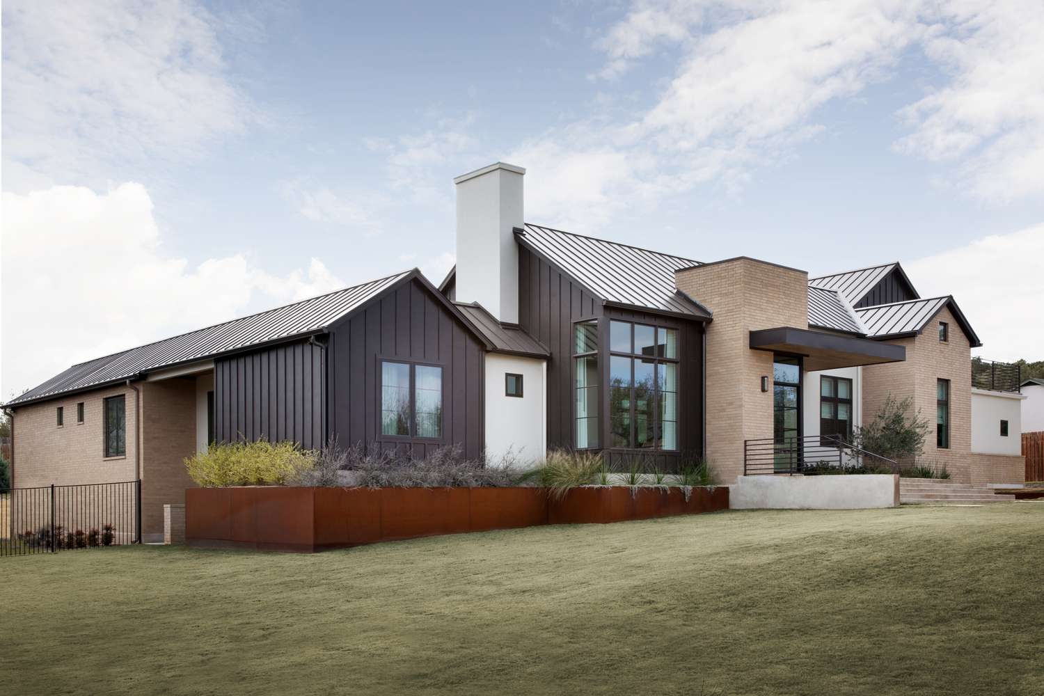 Metal boxes and green lawn modern landscape