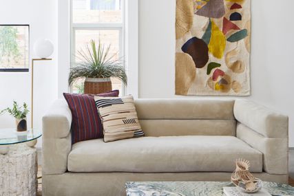 Austin living room with fiber art and velvet couch