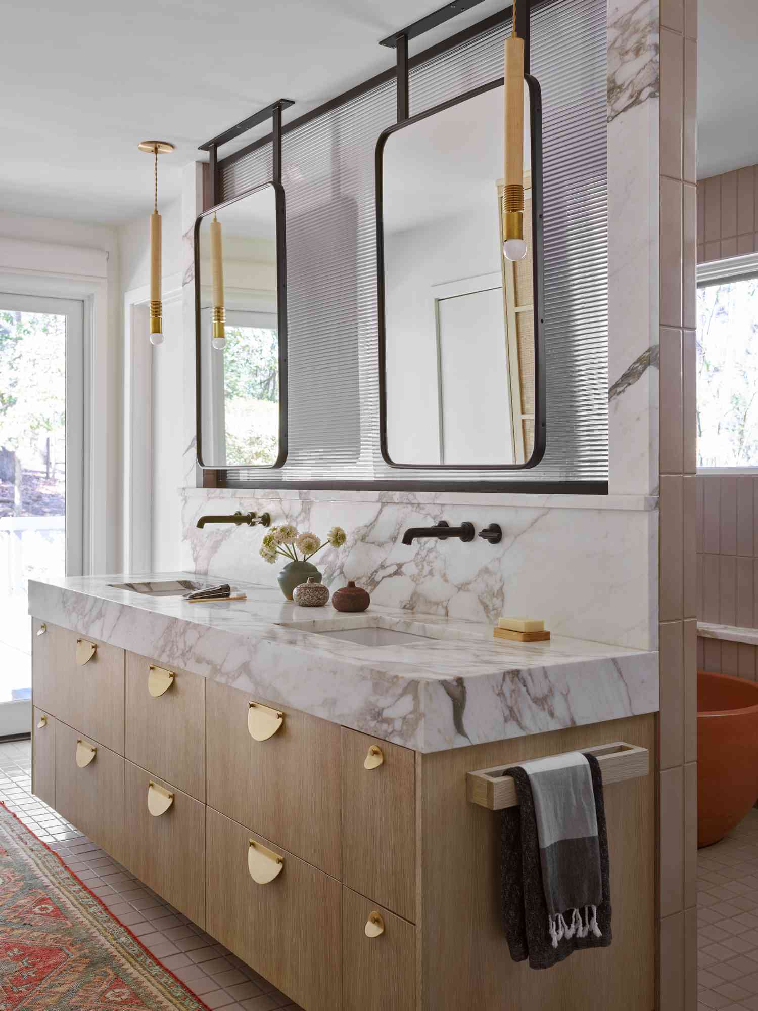 a white bathroom with mirrors 