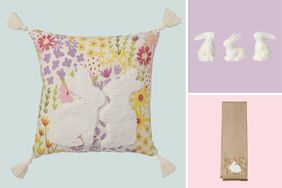 A decorative cushion with bunny designs ceramic bunny figurines and an embroidered tea towel with a rabbit motif