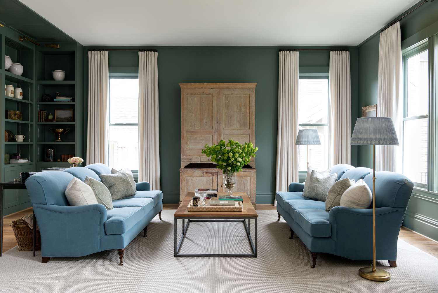 green walls with blue sofa