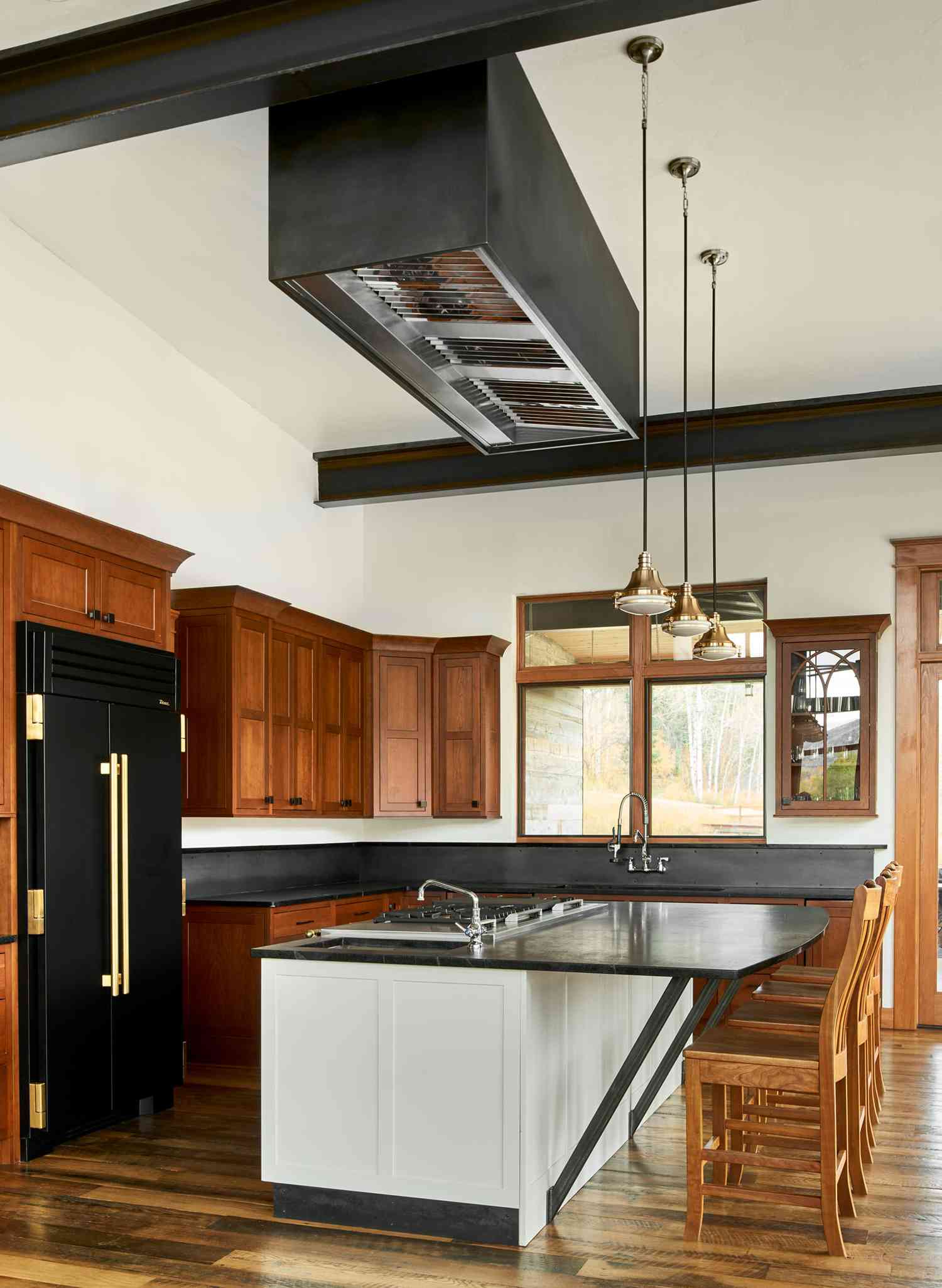 kitchen with wood cabinets and black and white details