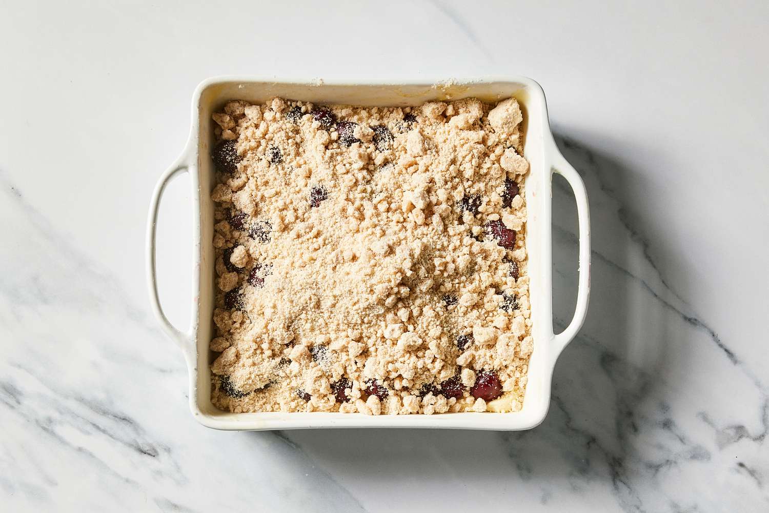 Sour Cherry Crumb Cake ready to bake with crumb topping