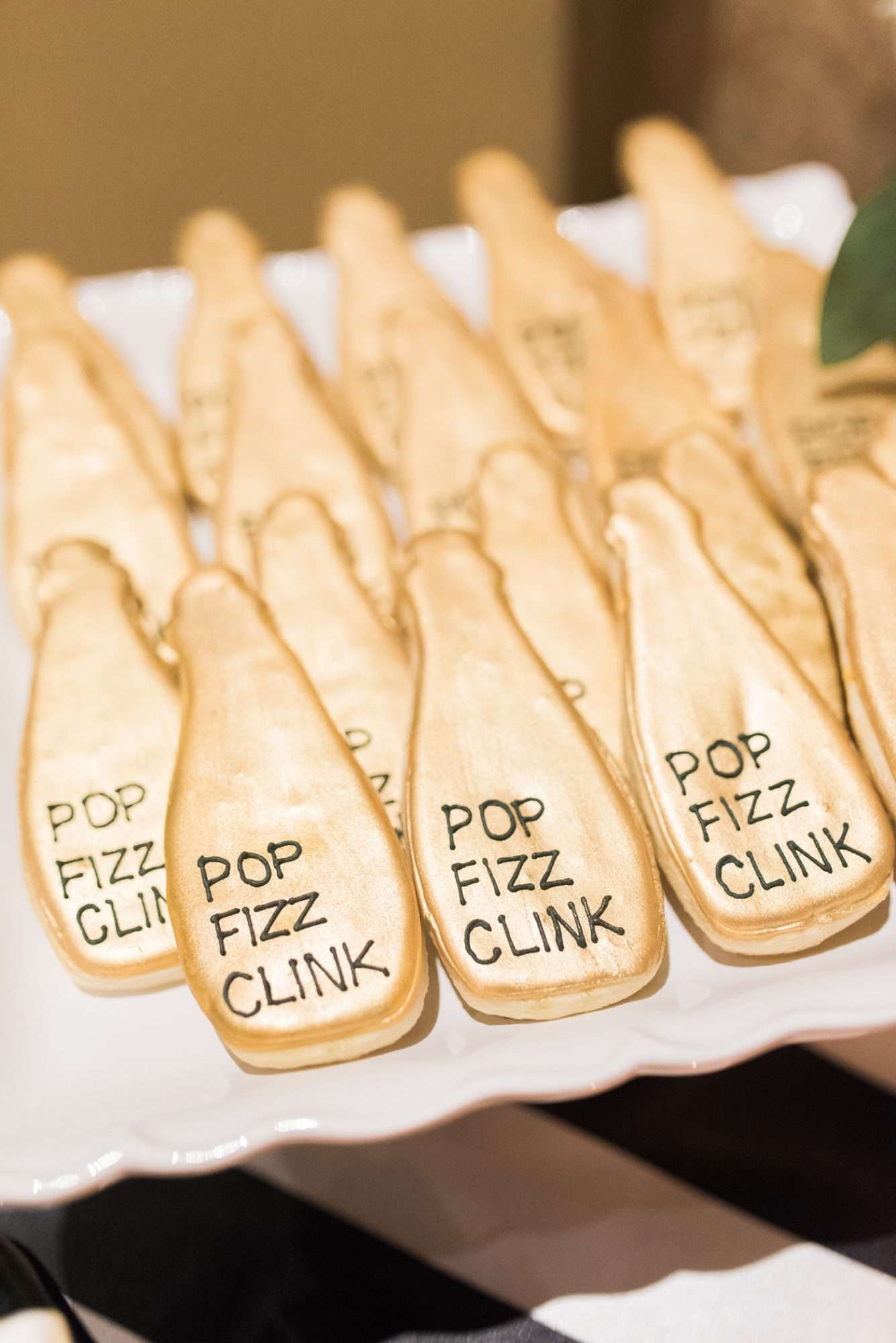 champagne shaped gold frosted cookies