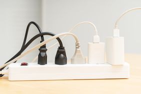 A power strip with multiple cables and plugs connected