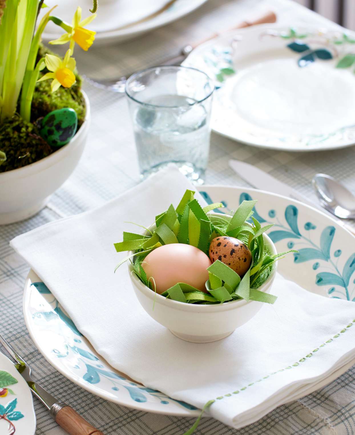 table setting egg bowl with ribbon grass
