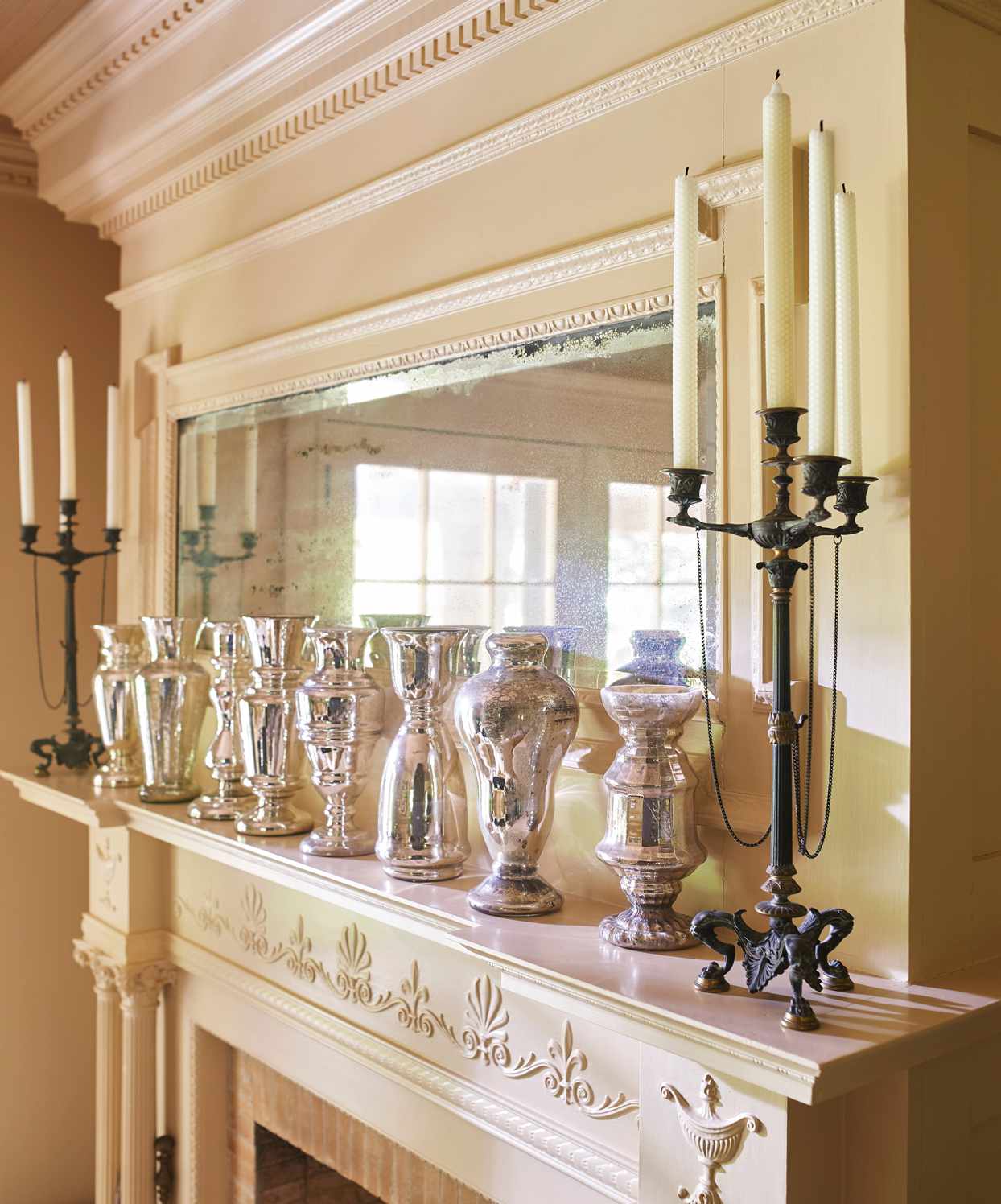 collection of mercury-glass vases line the living-room mantel