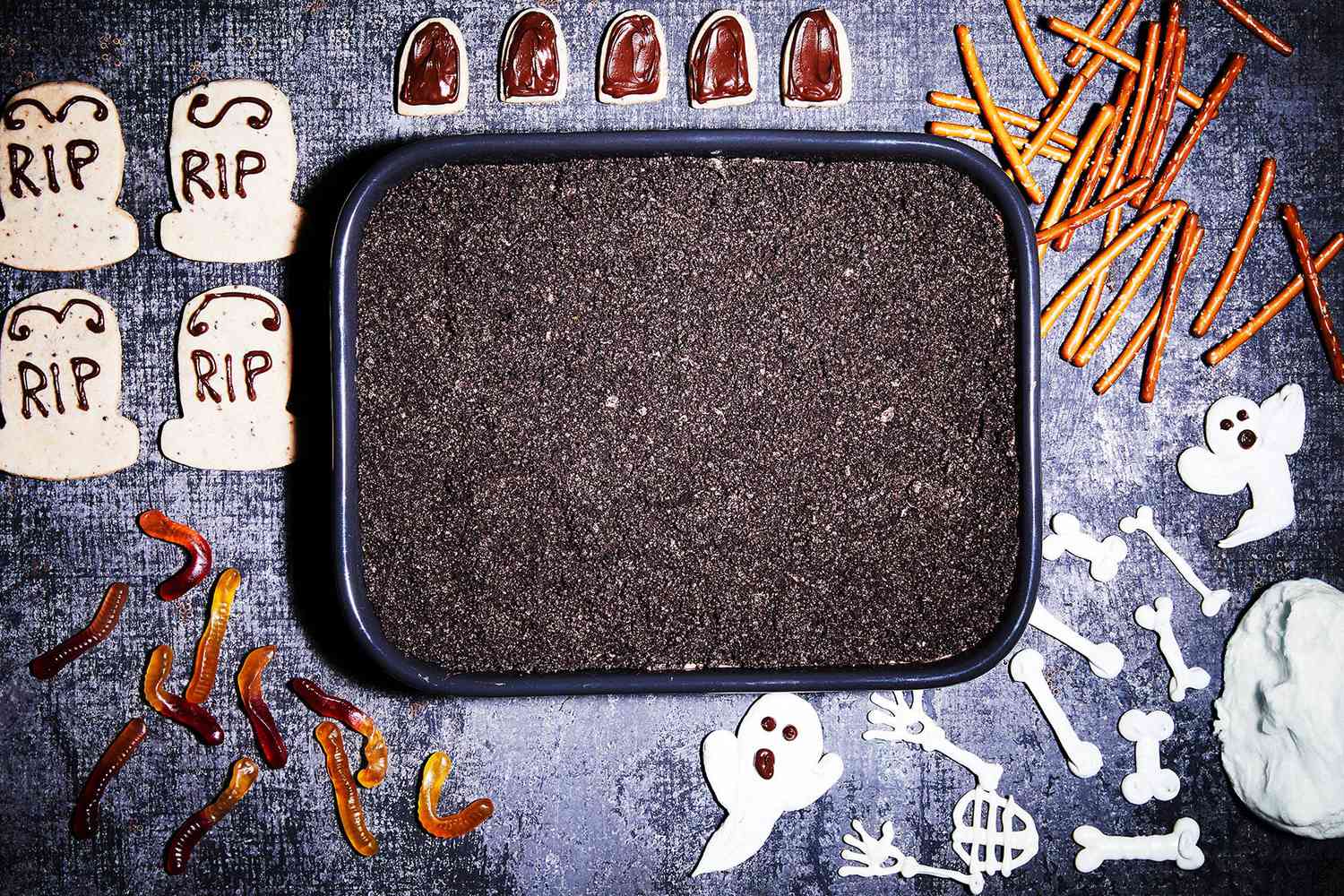 cake decorations surrounding Jane's Dirt cake on table