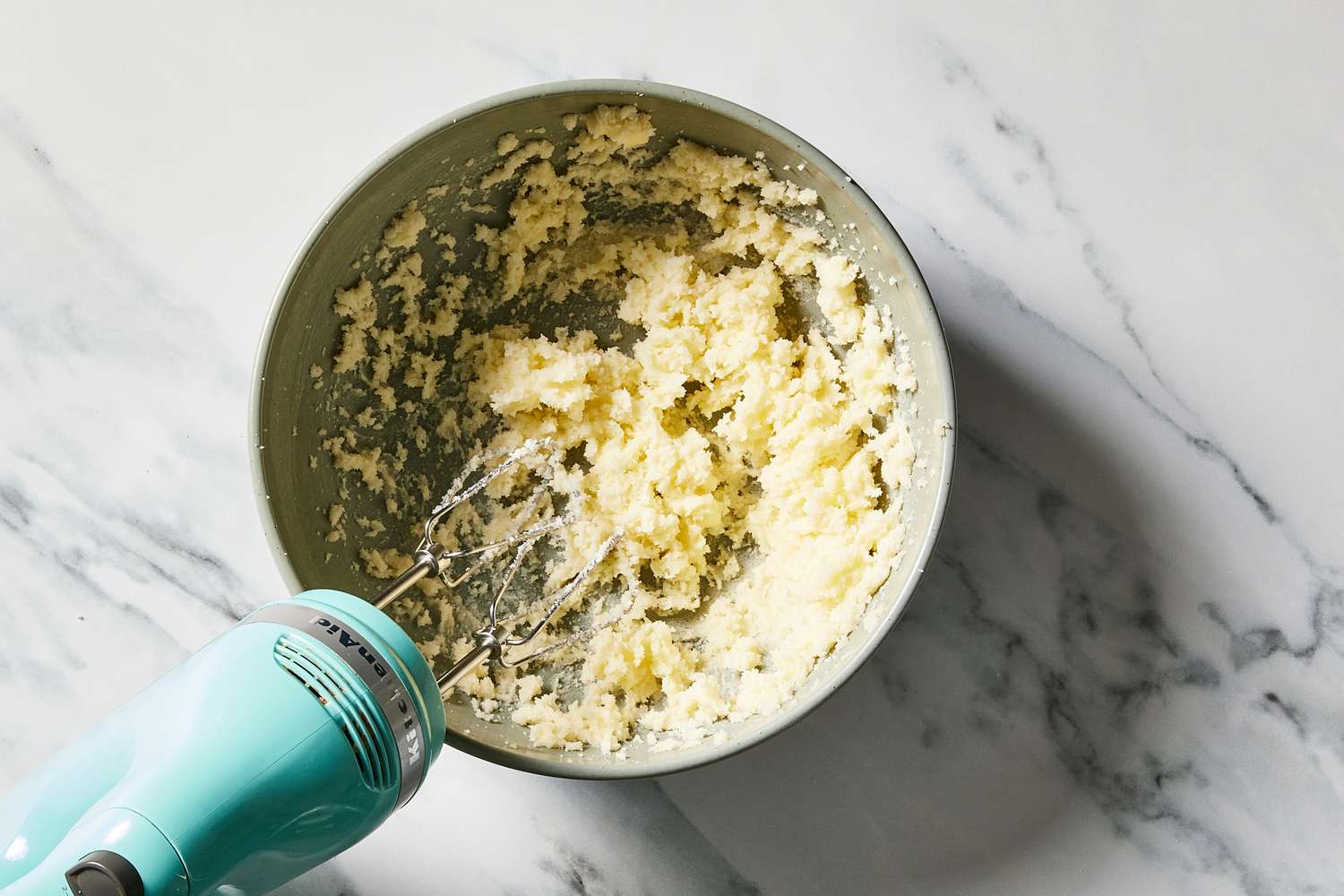 Butter and sage in bowl with hand mixer for Sour Cherry Crumb Cake