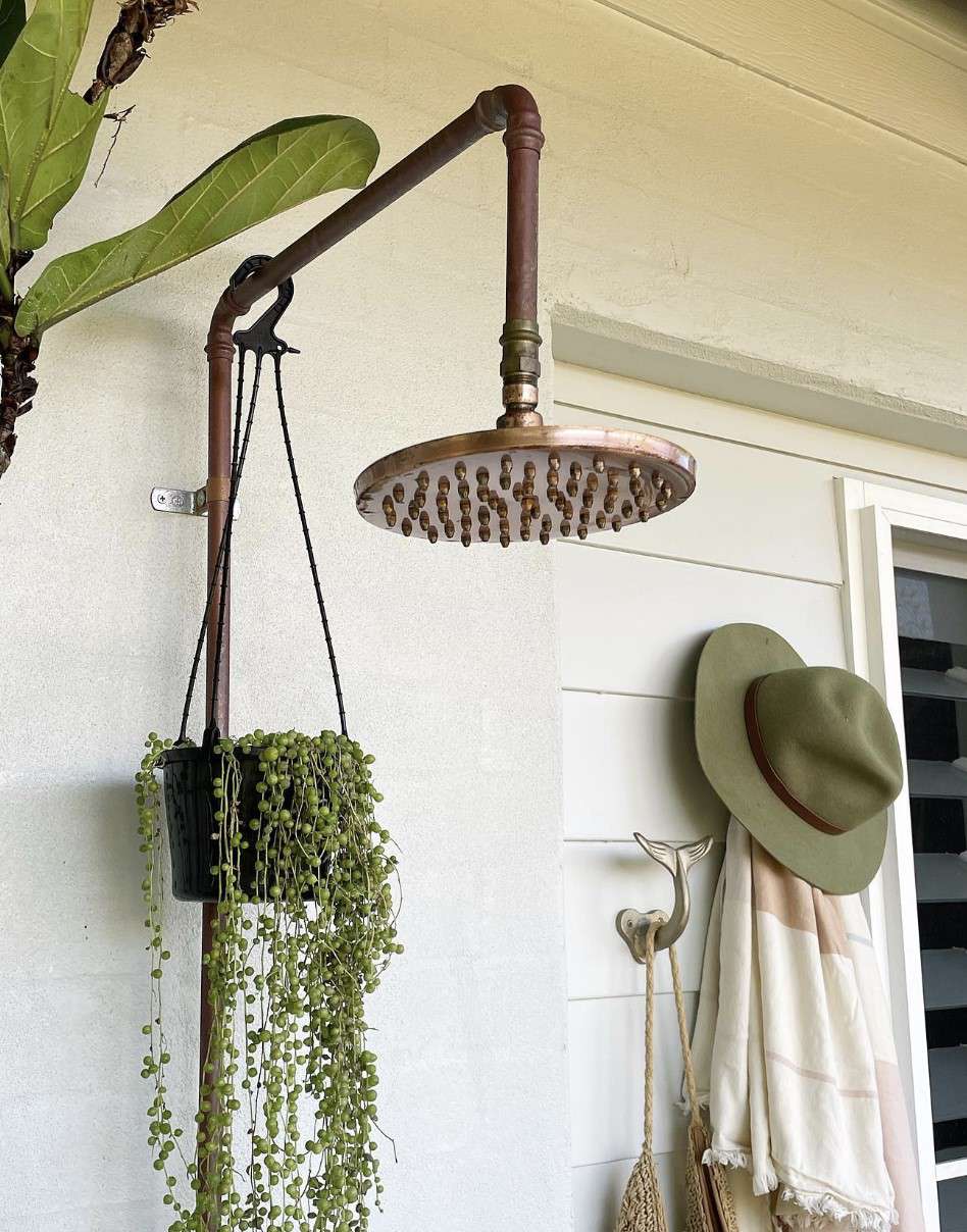 Copper eco friendly outdoor shower with hanging plant