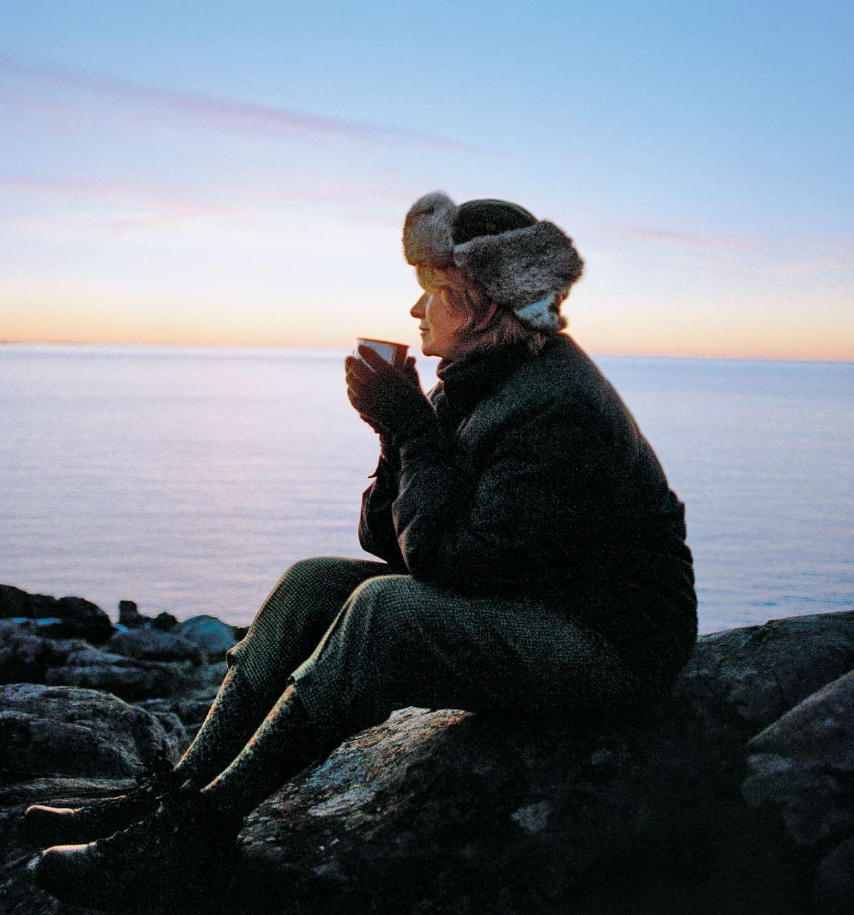 Martha taking in a sunrise in Maine