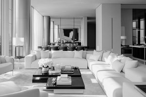 Spacious modern living room with floor to ceiling windows and contemporary furniture arrangement