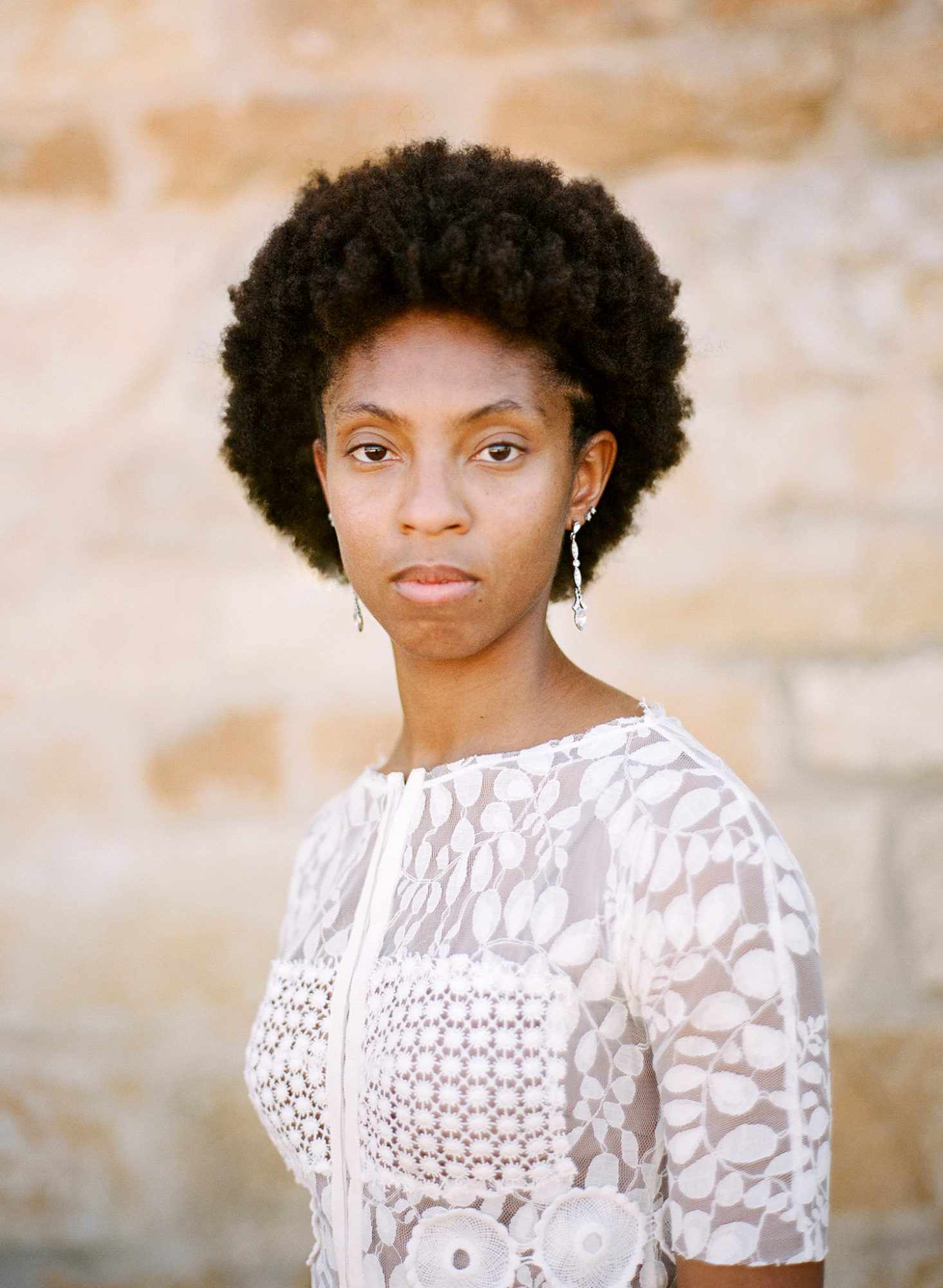 woman with bateau neckline and voluminous hair