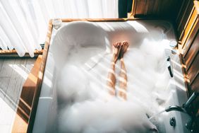 Person in jacuzzi hot tub bubble bath