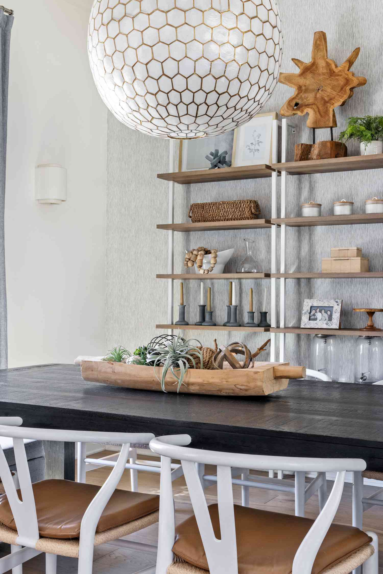 a dining area with shelves
