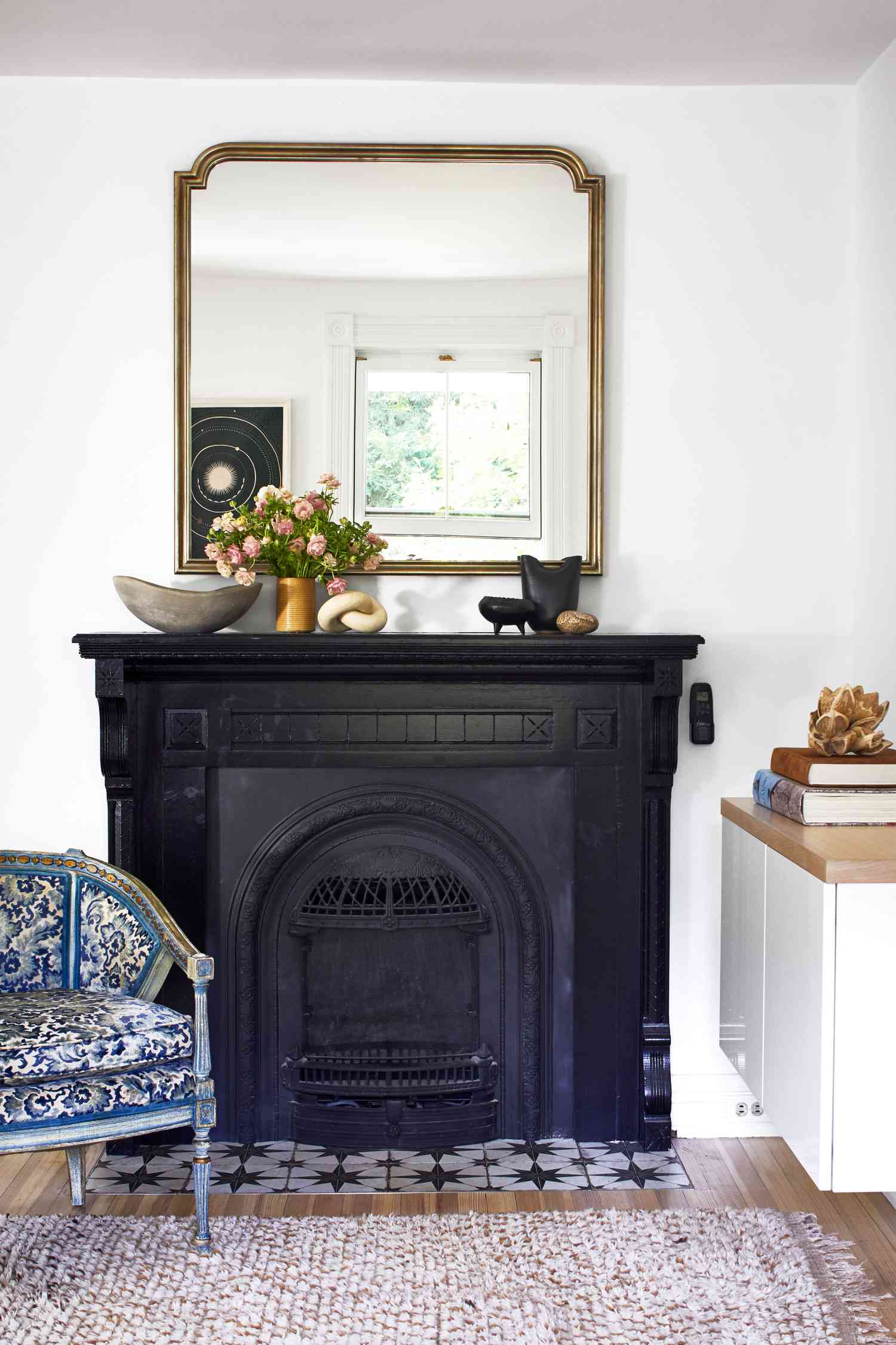 A large mirror over a fireplace