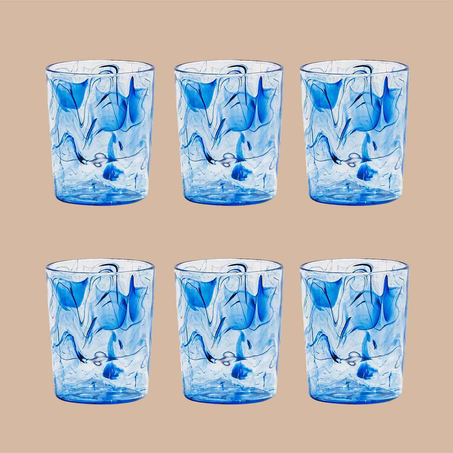 six swirled acrylic drinking glasses on tan background