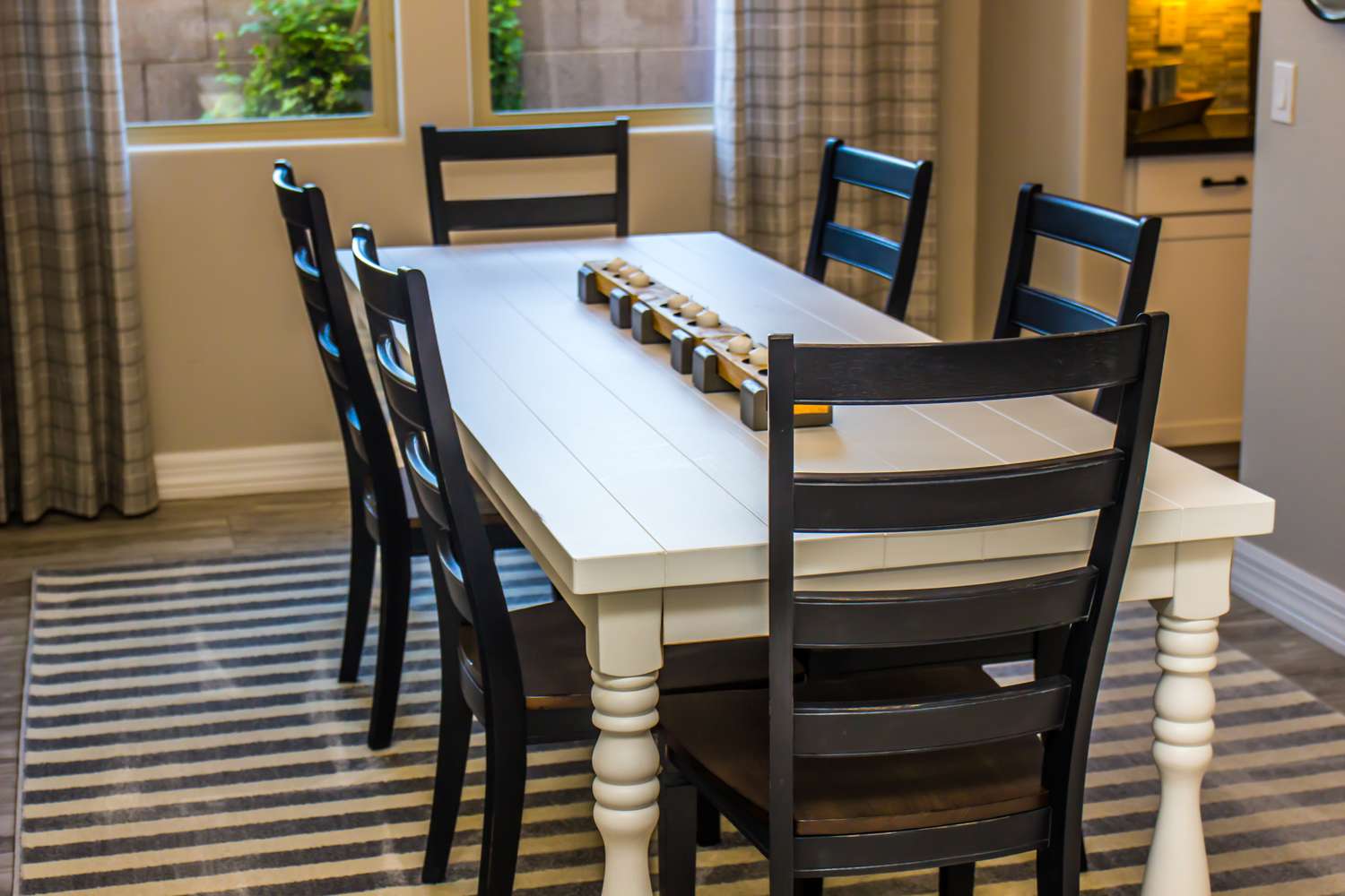 Dining table and chairs in a home interior setting