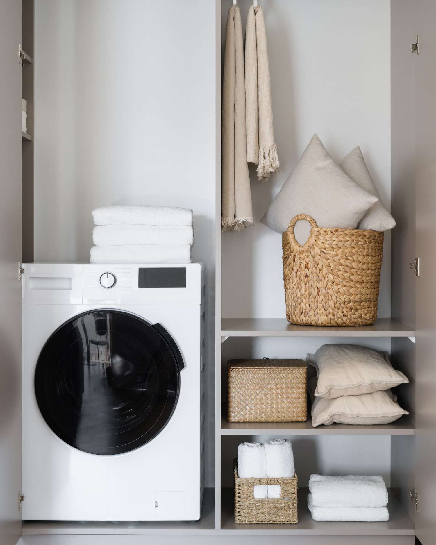Bathroom accessories and washing machine in cozy room interor design. Cleaning and laundry.