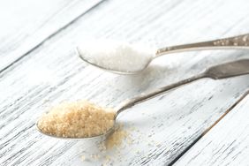 Two spoons with two types of sugar