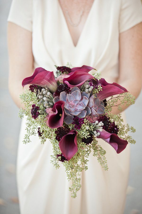 bouquet with maroon calla lilies succulents and seeded eucalyptus