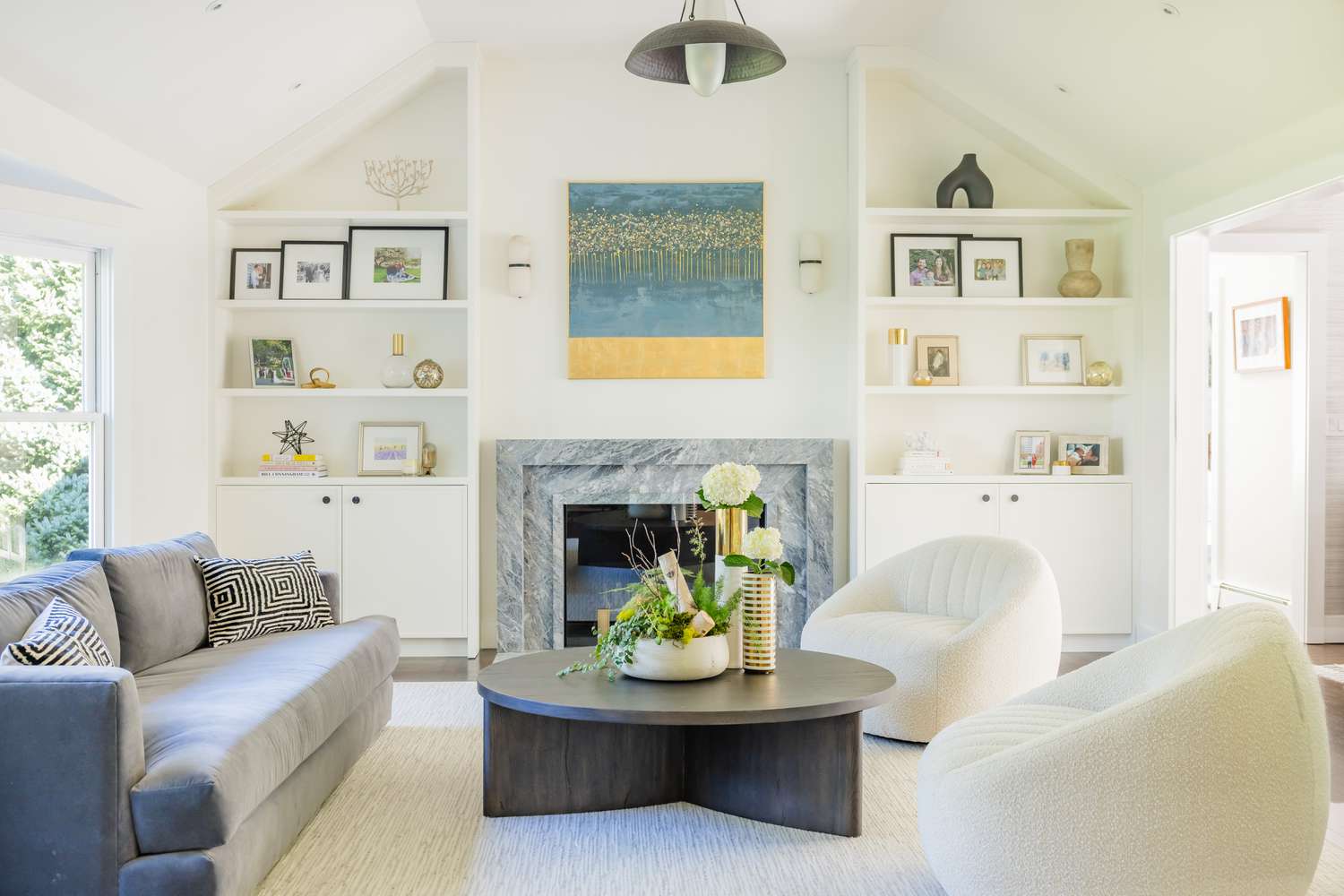 Gray Marble Fireplace with Colorful Art