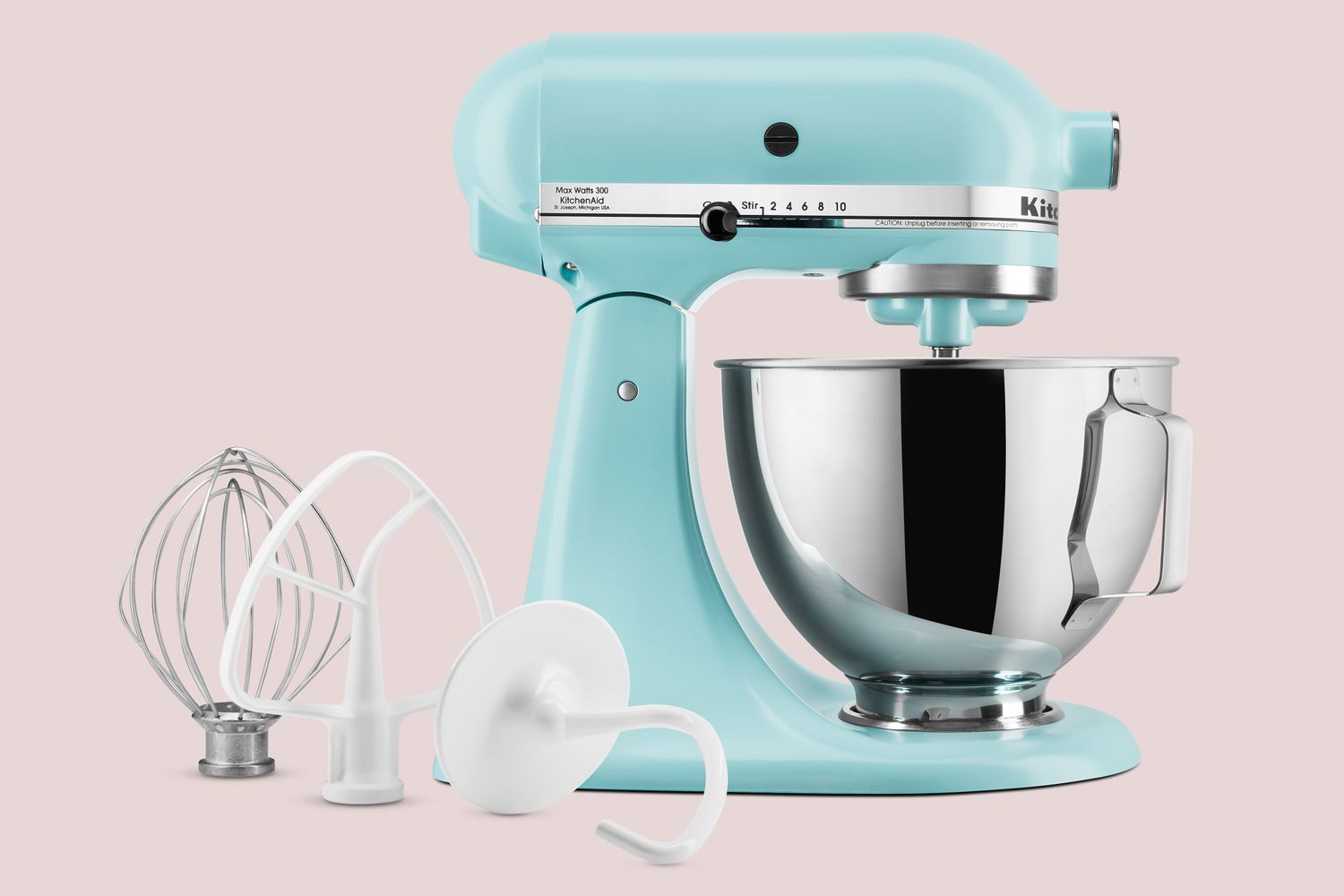 A stand mixer with attached mixing bowl whisk dough hook and beater attachments