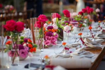 wedding table with bright floral arrangements