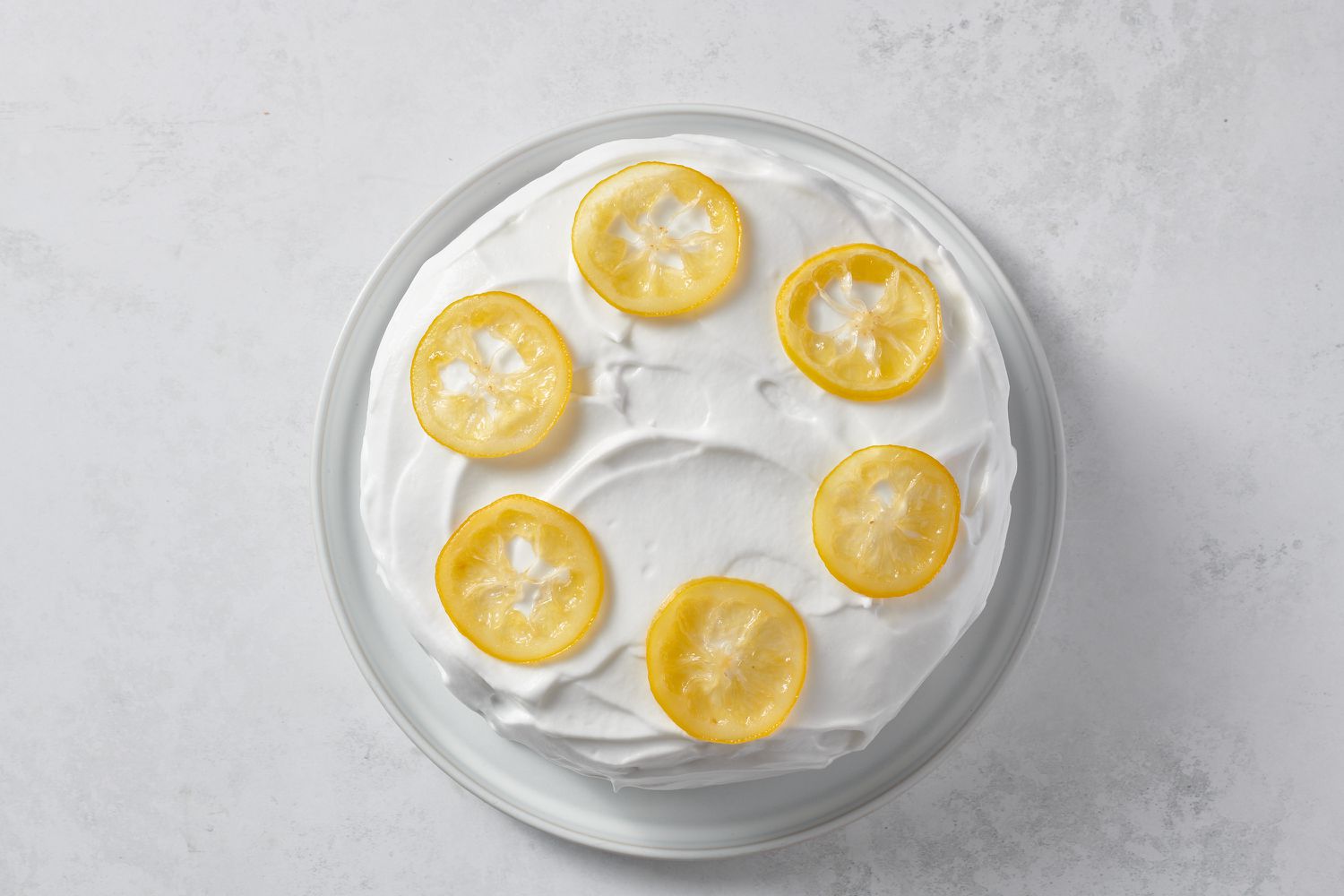 frosted lemon cake decorated with candied lemon slices
