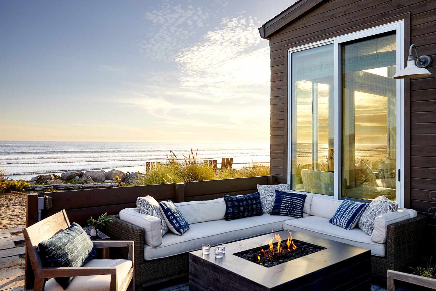 Porch with couch seating and bonfire pit