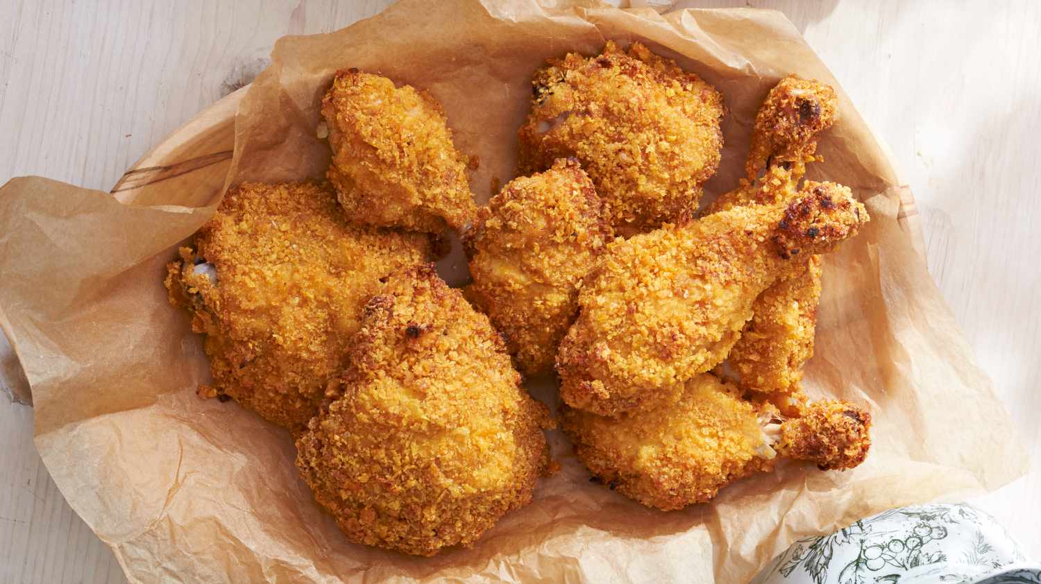 fried chicken on paper in a bowl