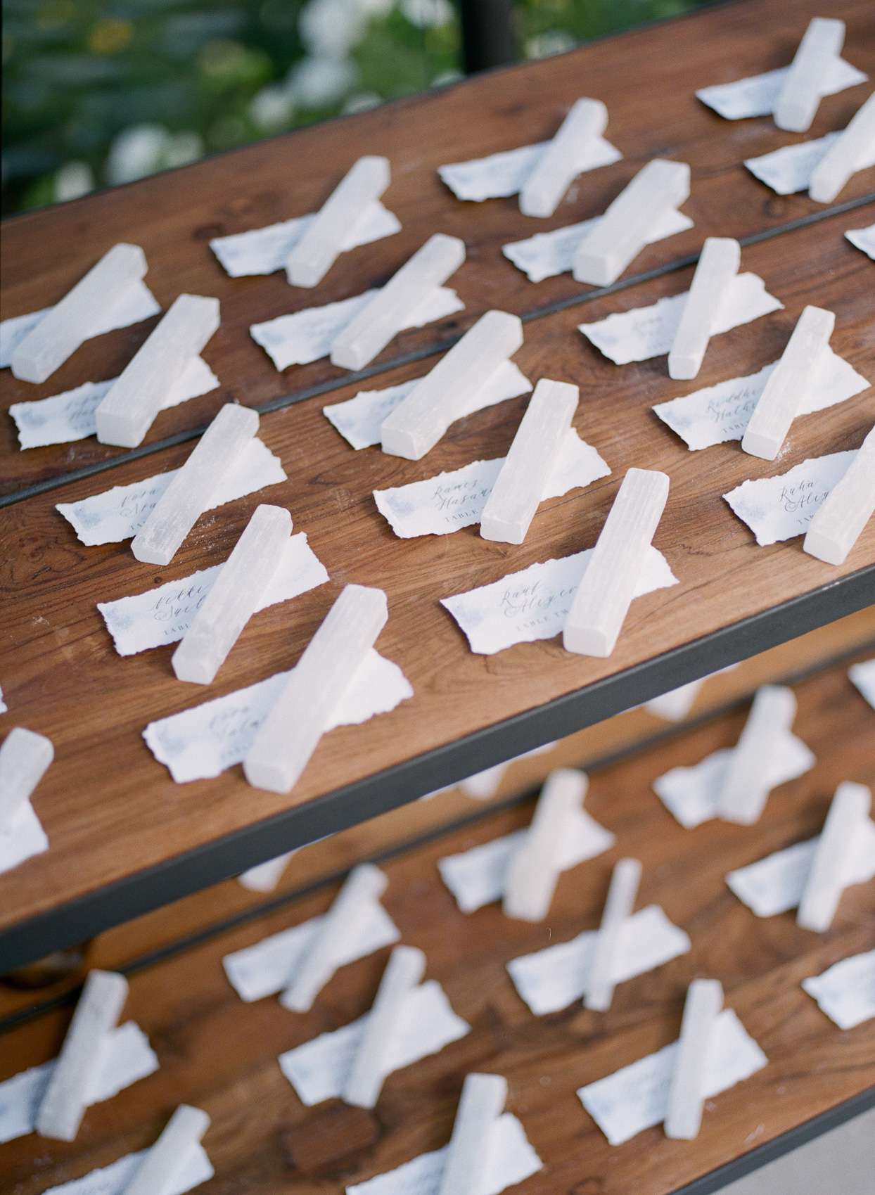 wooden table of wedding escort cards