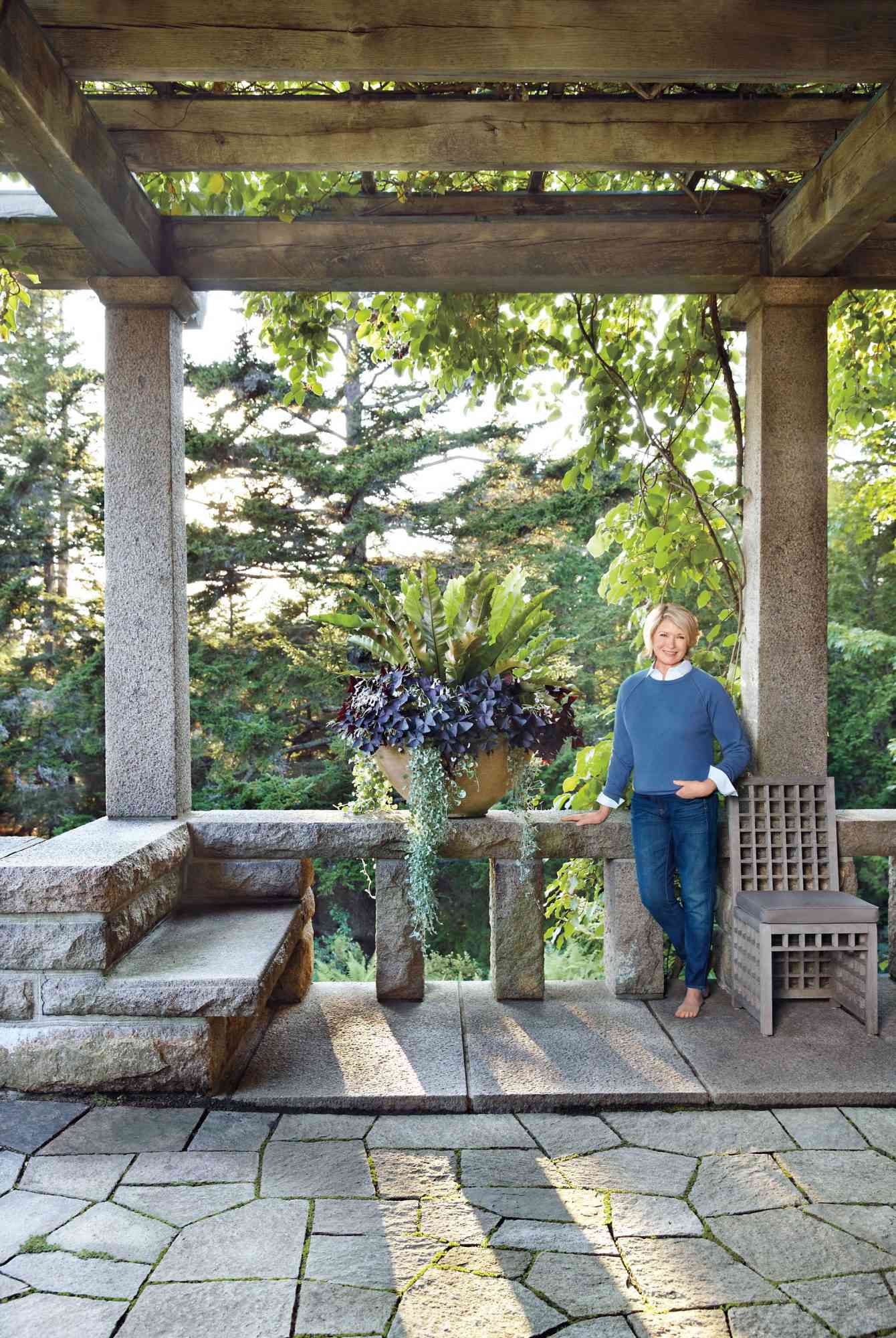 Martha by larger container with plants at Skylands