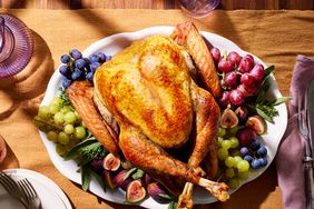 cooked turkey on a serving plate with fruit