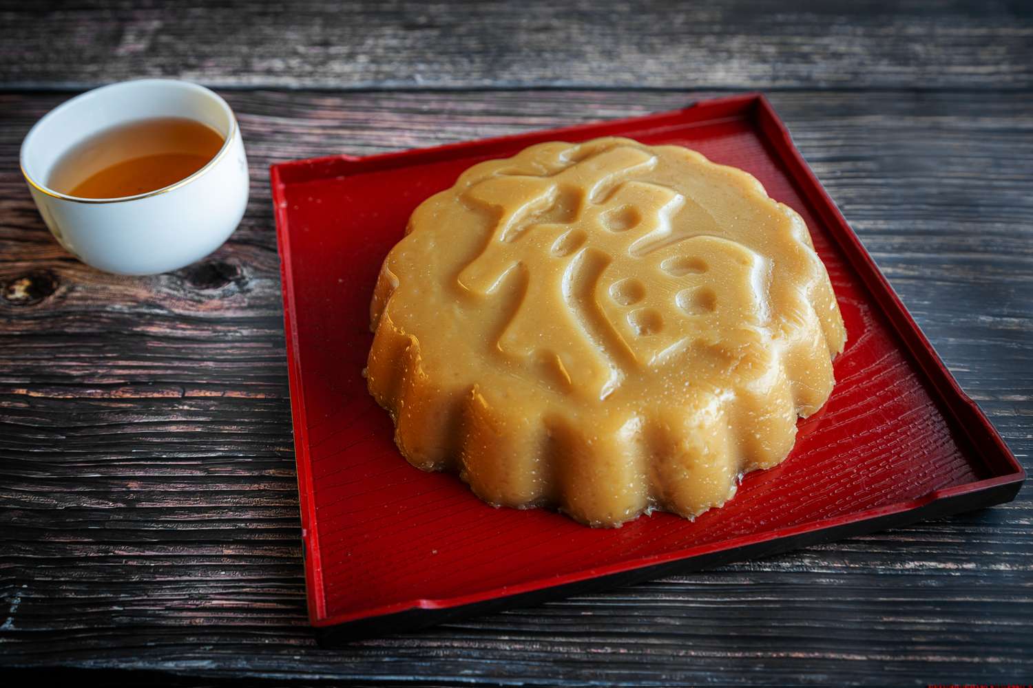 nian gao or sticky rice cake on a red square plate