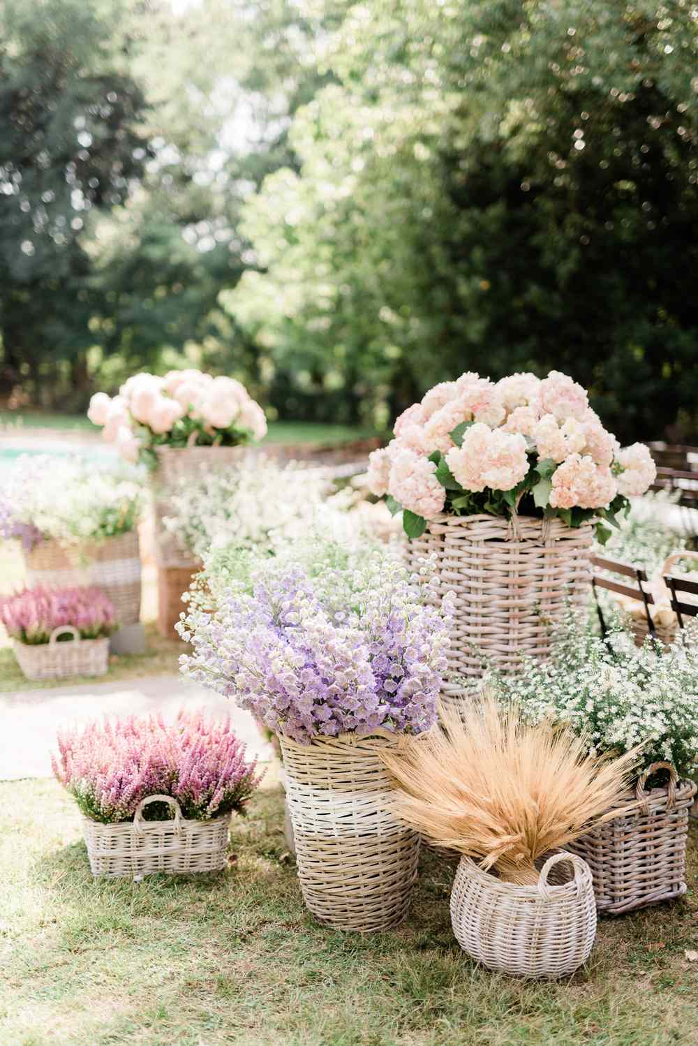 various sized wicker baskets holding pastel florals