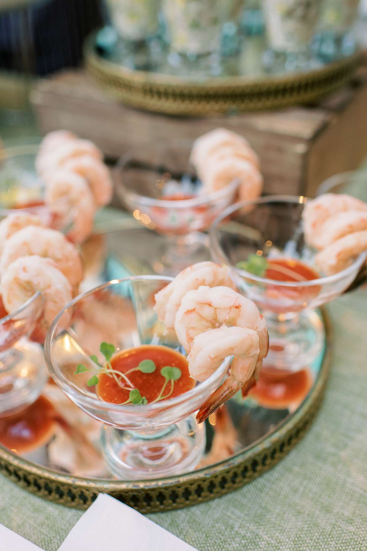wedding happy hour shrimp cups on gold and glass plate