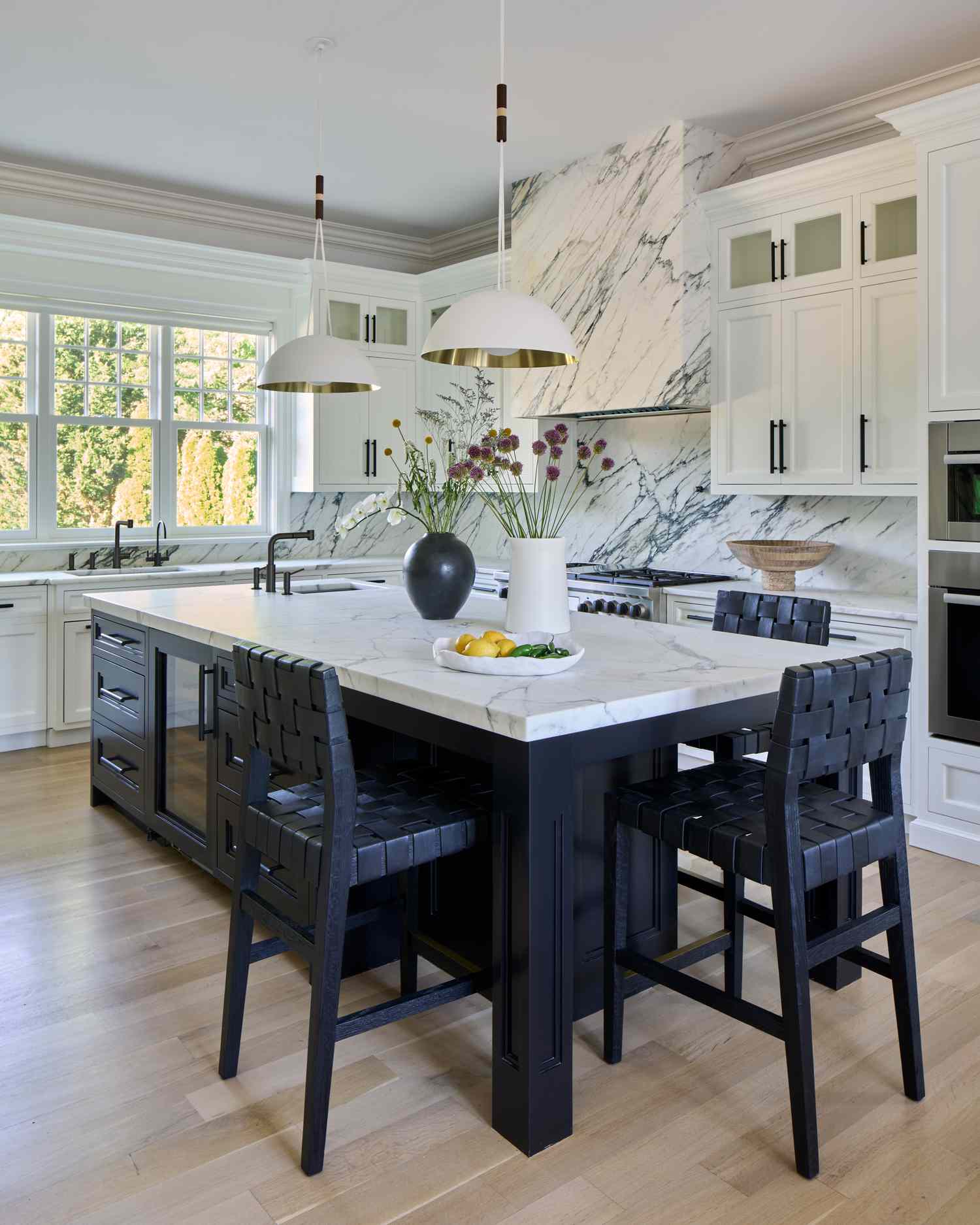 island with black counters and chairs