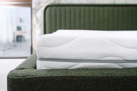 Memory foam mattress on green bed
