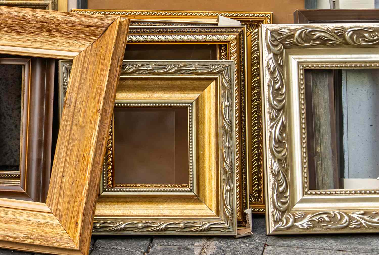 A group of empty picture frames leaning together