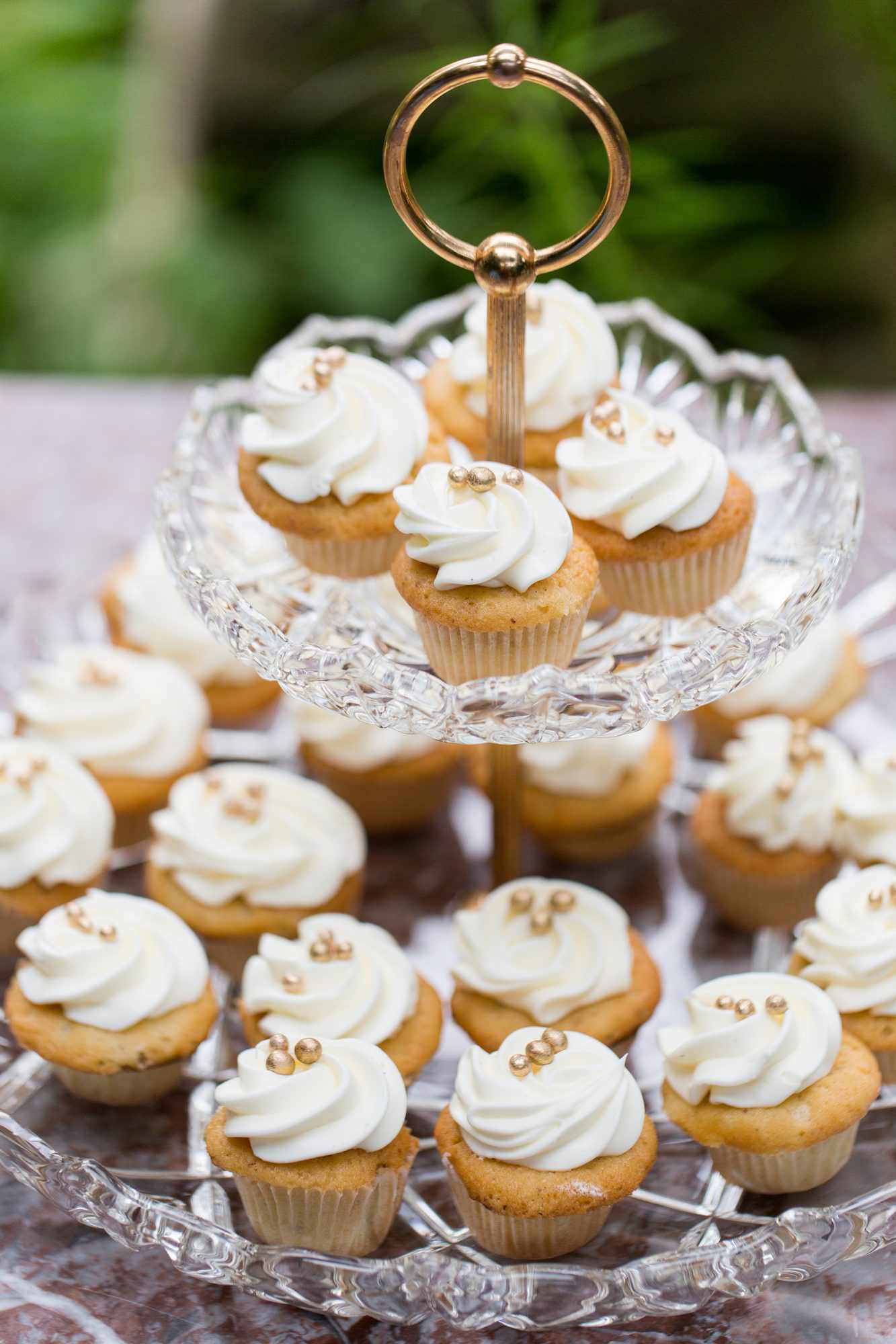 vanilla frosted cupcakes with gold pearls