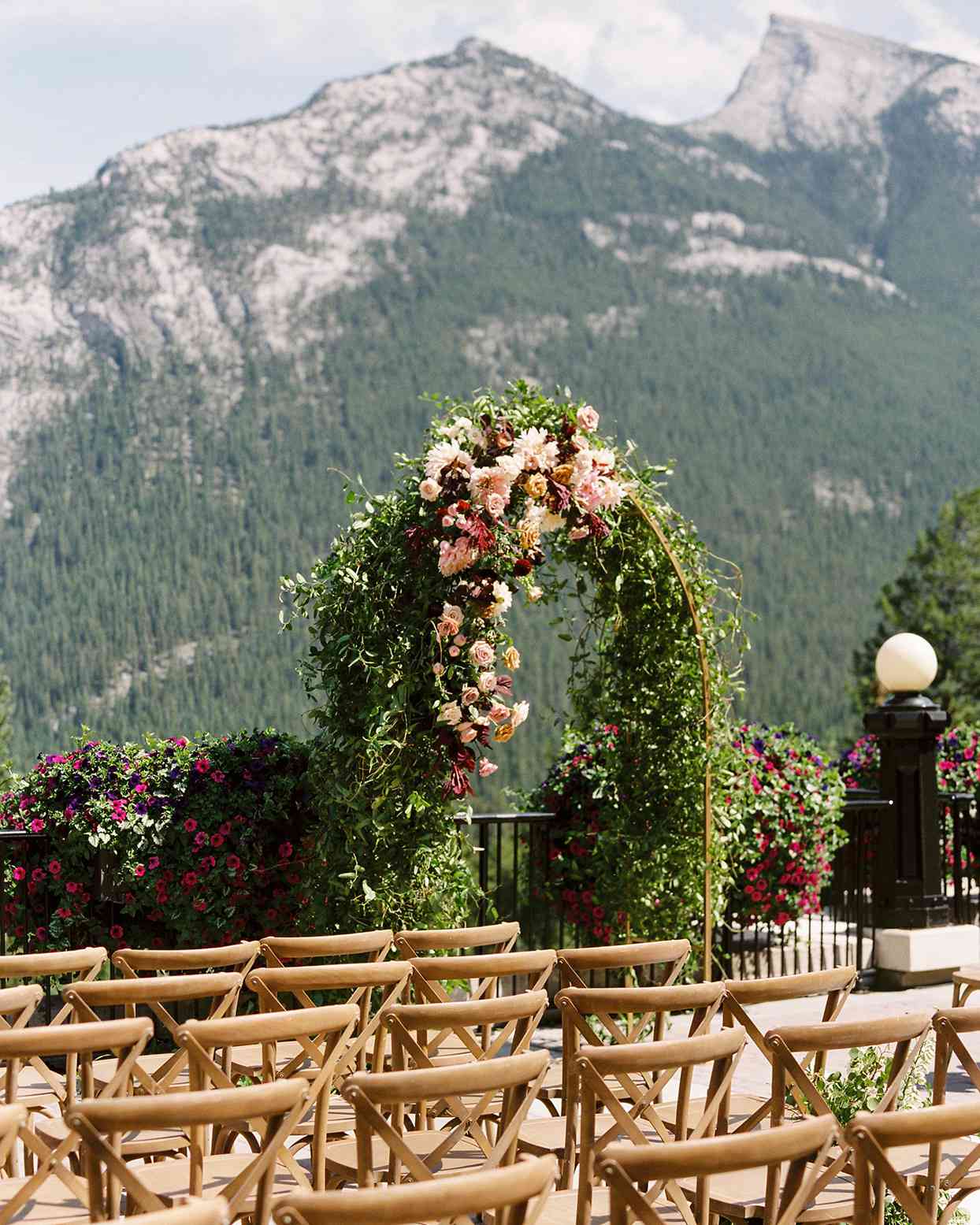 katie nicholas wedding arch with mountain backdrop