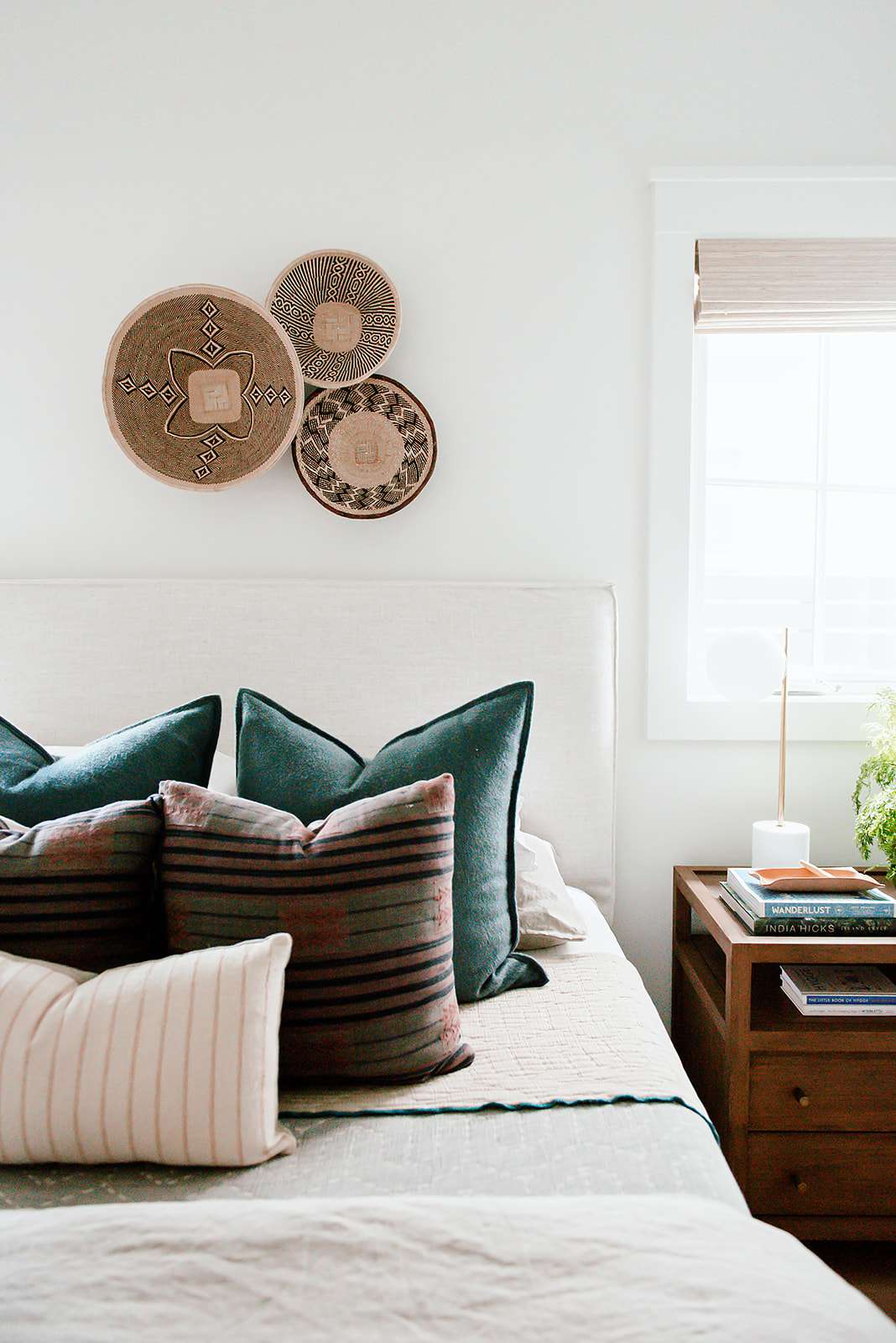 guest bedroom with basket wall decor
