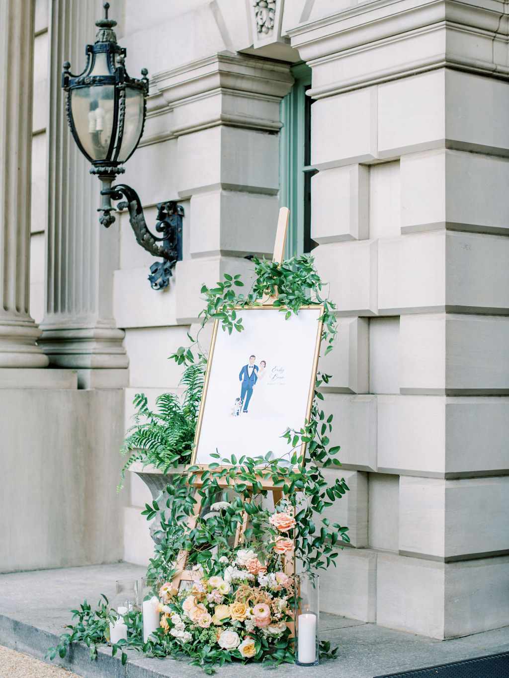 bride and groom with dog graphic welcome sign