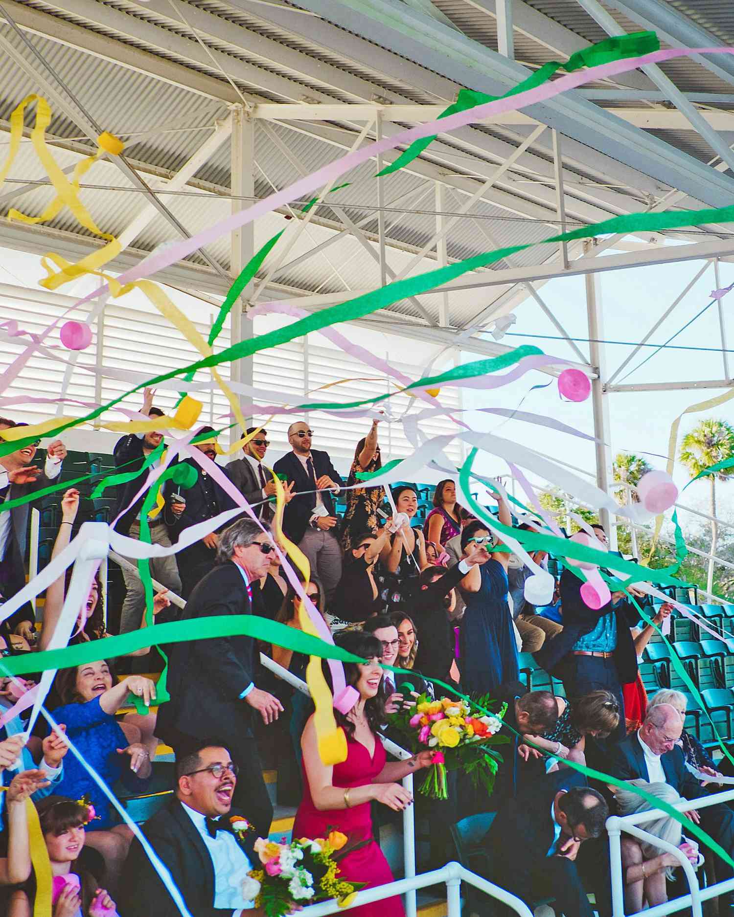 becca zac wedding ceremony streamers from crowd
