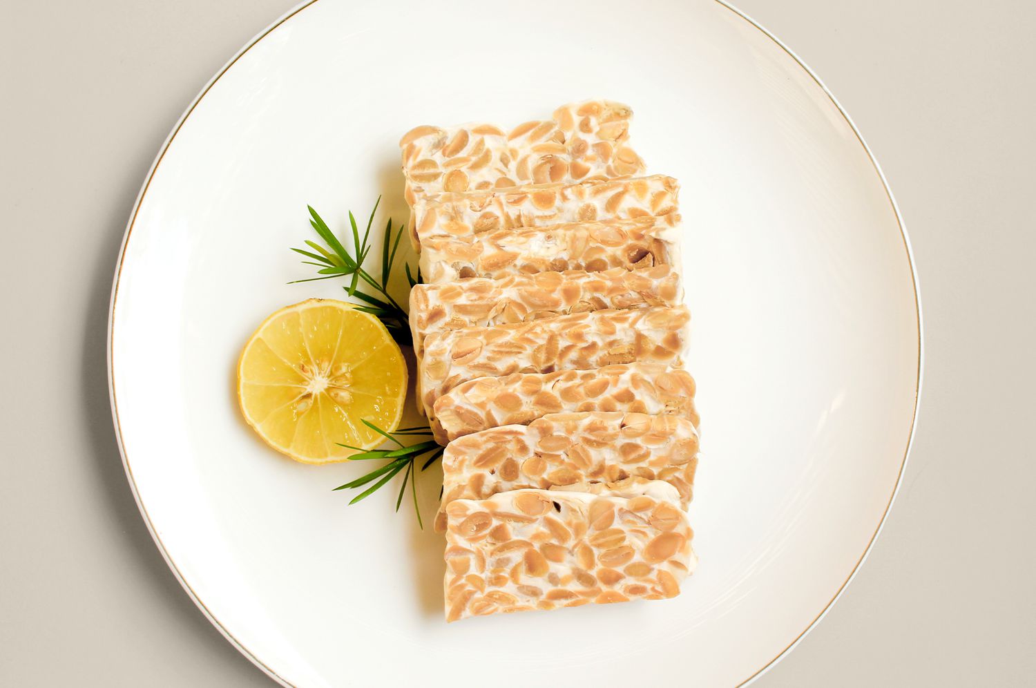 Tempeh and lemon on plate