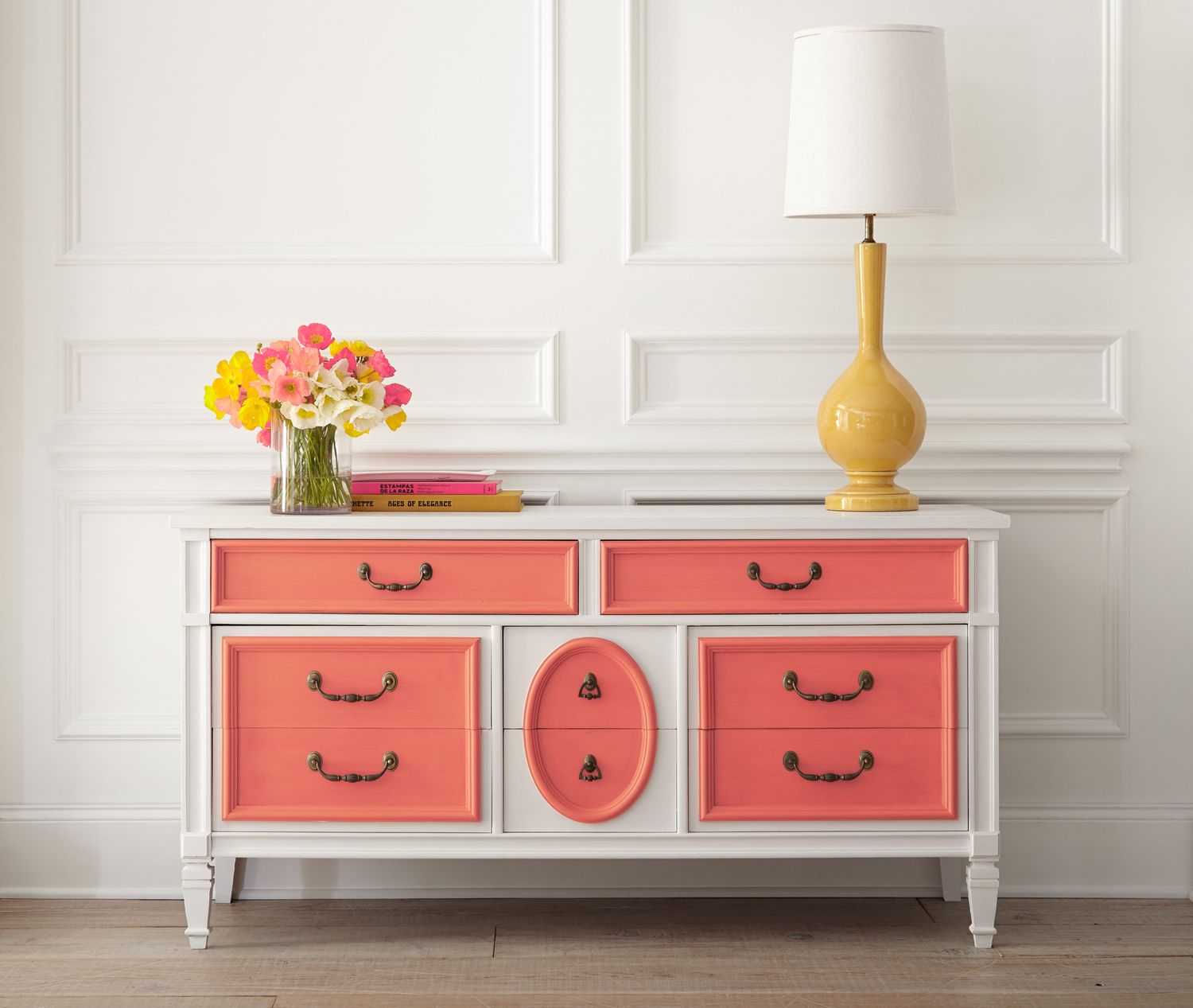 salmon coral dresser with yellow lamp
